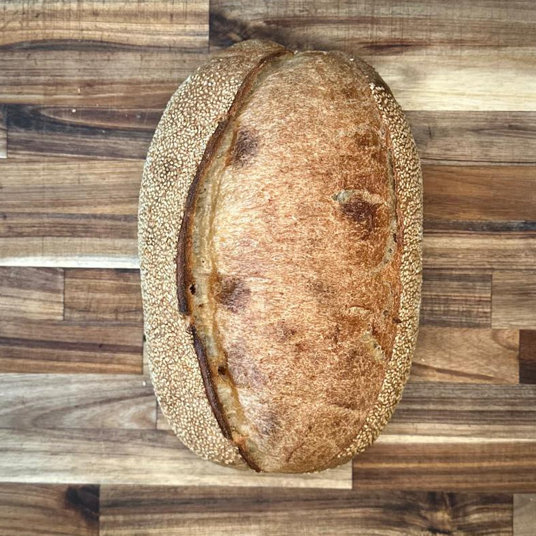 Loaf of bread on a wooden cutting board