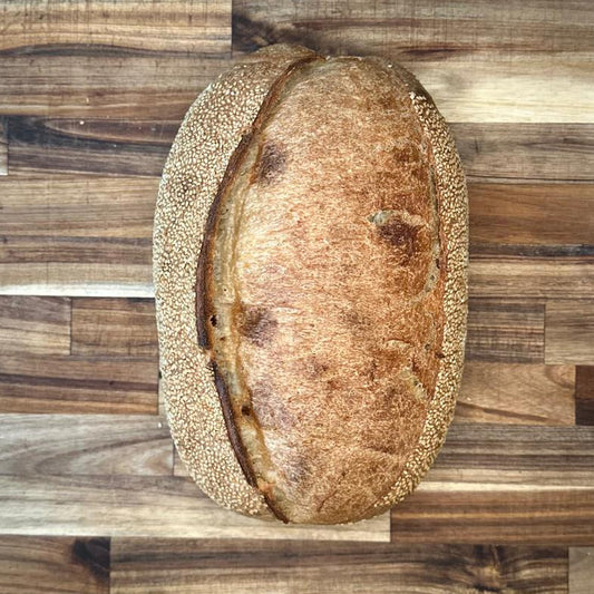 Loaf of bread on a wooden cutting board